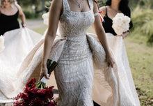 C2023-SD861 - sleeveless open neck line wedding gown with a beaded detachable train