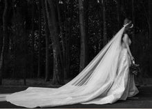 C2023-SD861 - sleeveless open neck line wedding gown with a beaded detachable train