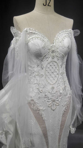 robe de mariée couture à manches longues et transparentes à VENDRE 