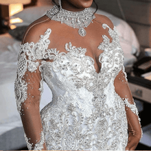 C2021-BiM012 - Vestido de novia transparente de manga larga con escote ilusión y cuentas de cristal con cola catedral